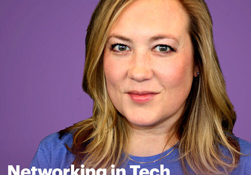 A woman wearing a purple shirt is engaged in networking conversations within the tech industry.
